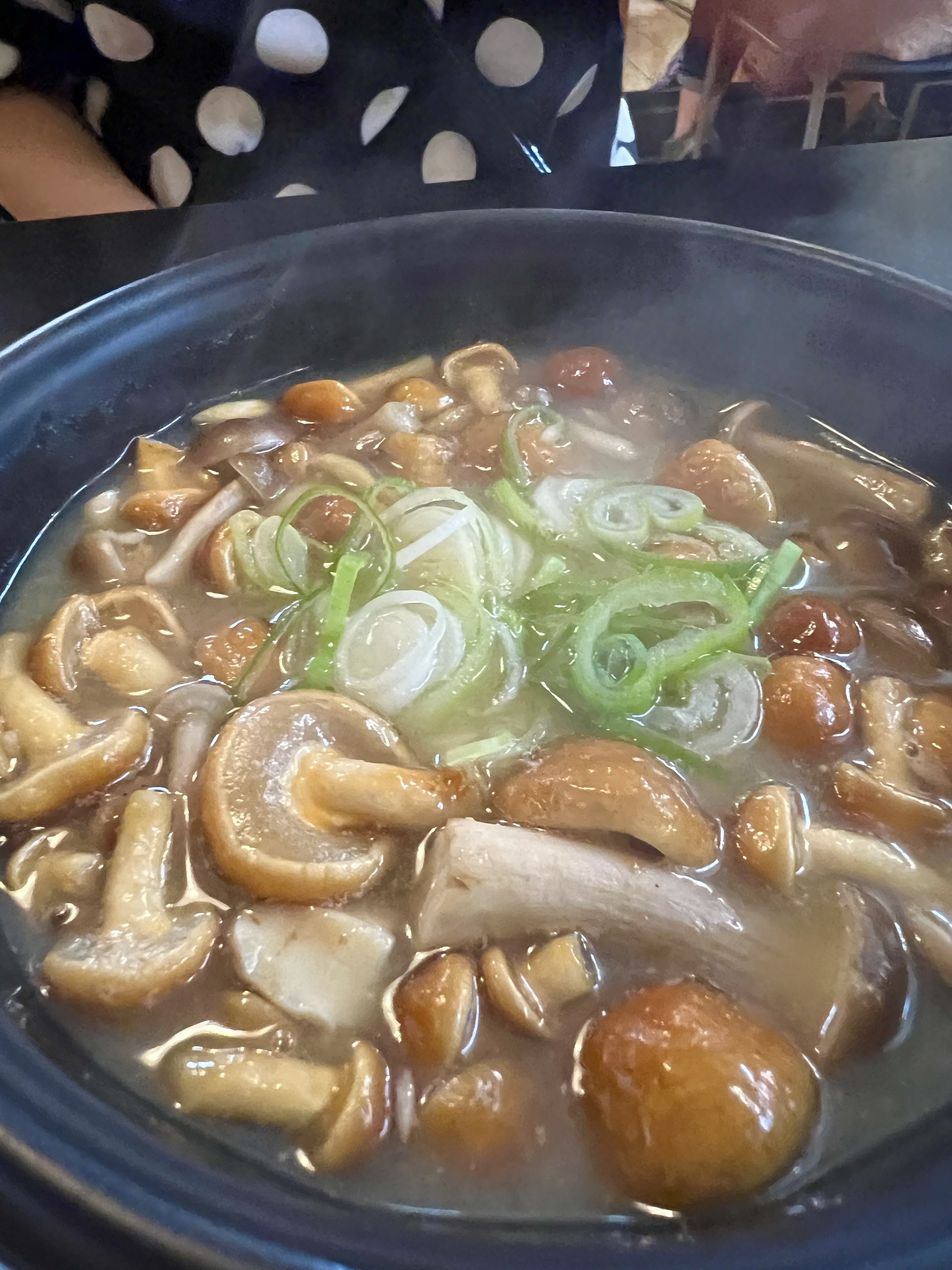 Close-up of nameko mushroom miso soup at Kinoko Oukoku — fresh nameko mushrooms and green onion in dark miso broth