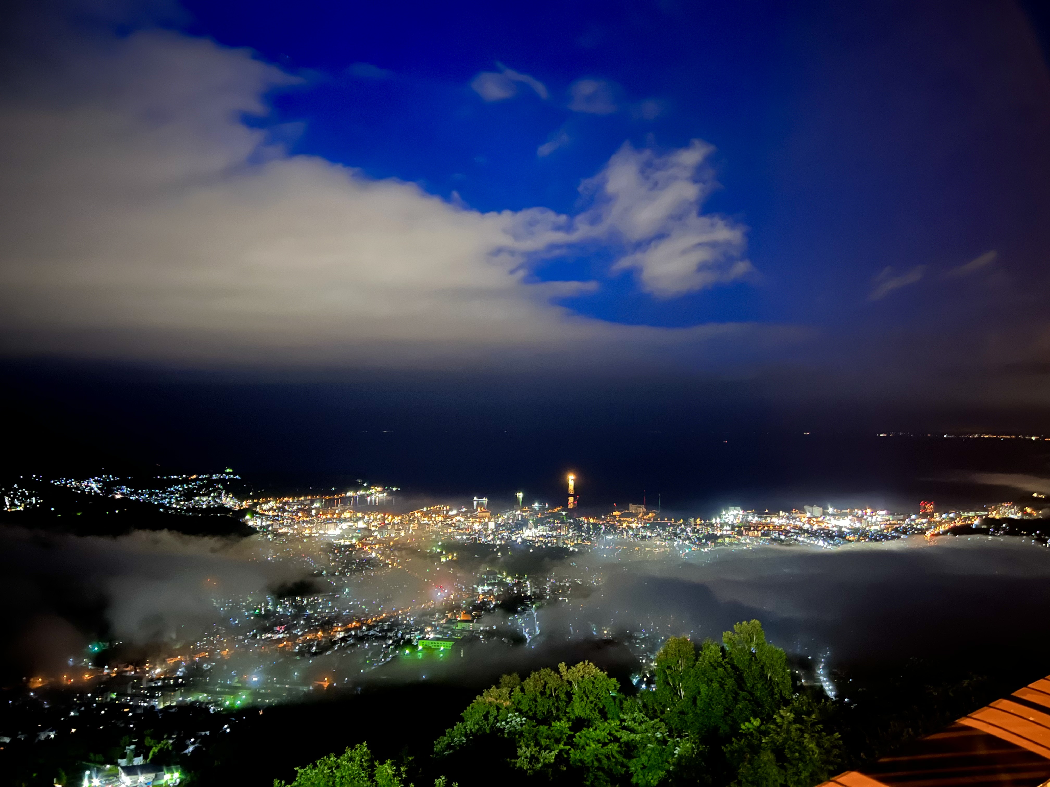 Otaru city lights wrapped in fog at night, seen from Tengu Yama
